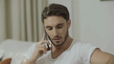 man talking on mobile phone at home stock footage sbv 334292312 storyblocks