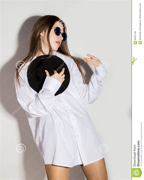 Naked Girl In A Man S White Shirt Sunglasses And Black Hat Stock Photo