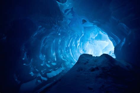 An Inside Shot Of A Beautiful Blue Ice Cave Stock Photo Download