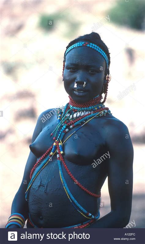 Girl Of The Nuba Tribe With Elaborate Cicatrization Scarring Stock