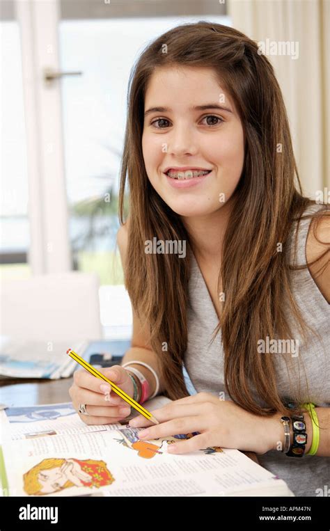 Teenage Student Doing Homework At Home Stock Photo Alamy