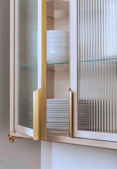 Having glass kitchen cabinets doesn't mean you have to replace your cabinets. reeded glass door insert, fantastic handles | Armoire avec ...