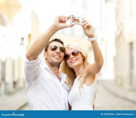 Travelling Couple Taking Photo Picture With Camera Royalty Free Stock