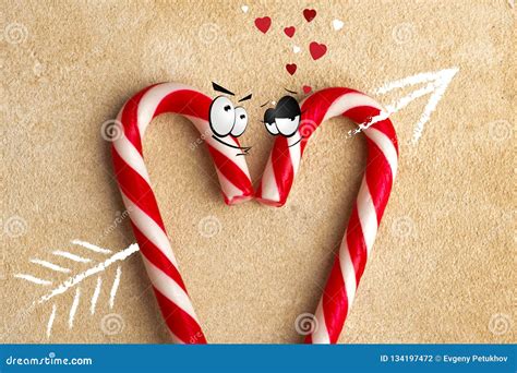 Two Lovers Candy Cane With An Arrow Symbol Pierced Heart Stock Photo