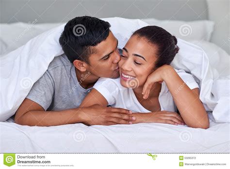Couple kiss bedroom stock photo. Image of love, attractive - 53265372