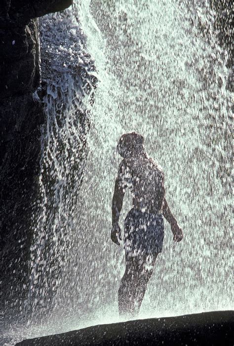 Young Man Standing Under Waterfall Photograph By Henry Georgi Fine