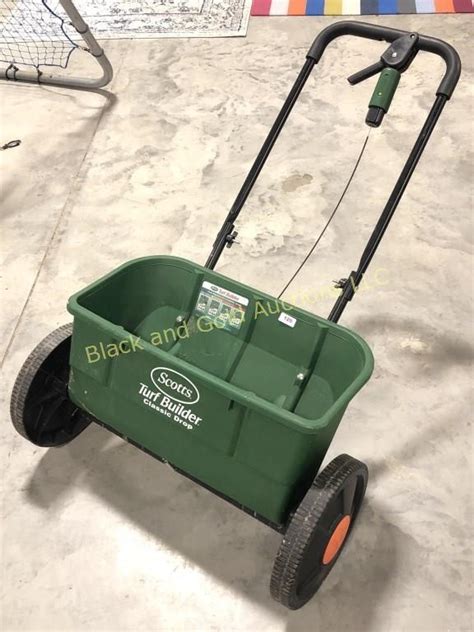 There are different types of lawn spreaders on the market but they why should you buy a broadcast spreader over a drop spreader? Scotts Turf Builder Classic Drop Spreader | Black and Gold Auctions LLC