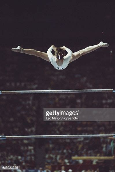 Romanian Gymnast Nadia Comaneci Pictured In Action During Competition