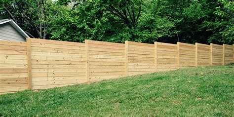 How A Wood Fence Is Installed On A Sloping Lot Timber Fencing