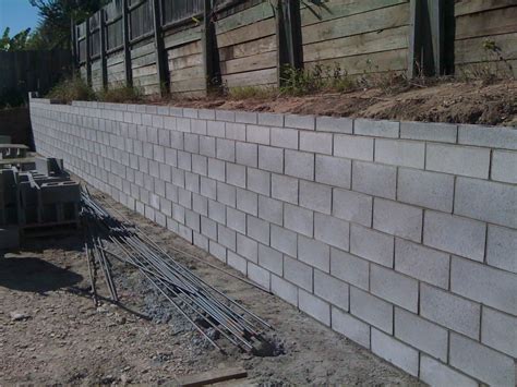 Cost of decorative block retaining wall. How to Build A Cinder Block Retaining Wall With Rebar - AllstateLogHomes.com