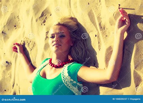 Woman Lying On Sandy Beach Relaxing During Summer Stock Image Image