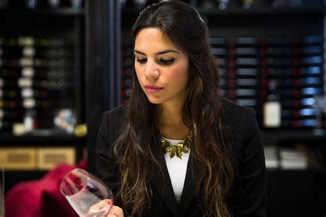 professional sommelier examining red wine by stocksy contributor jayme burrows stocksy