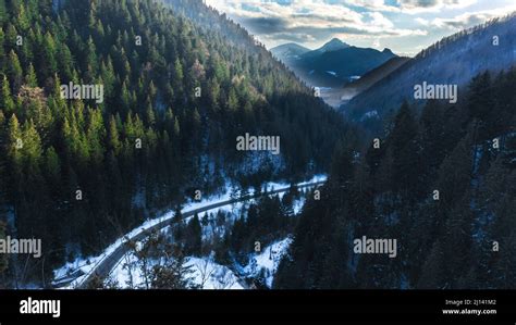 Aerial View Of A Road Winding Through A Winter Landscape Hi Res Stock
