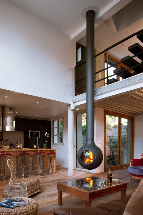 Build a fire wood holder from plumbing pipes. CENTRAL HANGING FIREPLACE BATHYSCAFOCUS OBLO ...