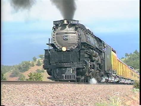 Tracking Left Shot Of A Union Pacific Steam Passenger Train Stock