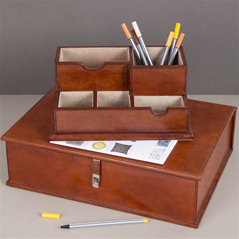 Leather desk pads are used to provide a smooth, even surface for writing and working while simultaneously protecting the user's desk from damage. the sussex leather desk set by ginger rose ...