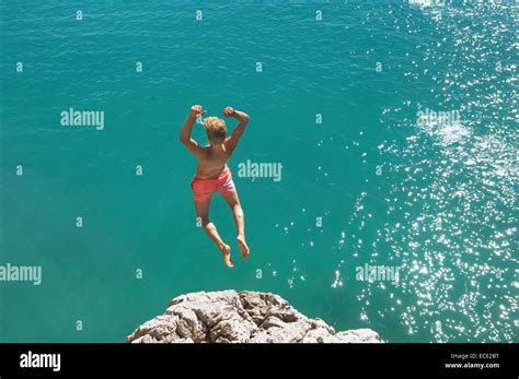 Teenager Water Cliff Sunshine Summer Holiday Jump Stock Photo Alamy