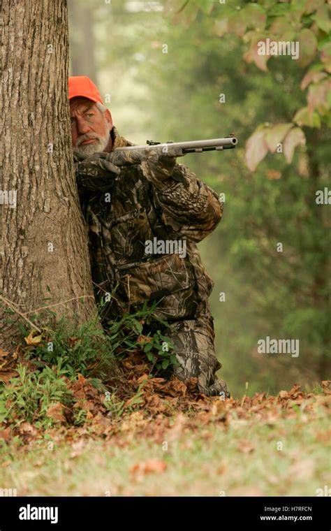 Hunter Stalking Whitetail Deer With Rifle Stock Photo Alamy