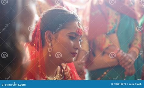 Beautiful Indian Nepali Bride In A Red Traditional Dress With Tika