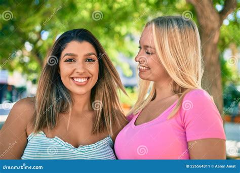 Two Beautiful And Young Girl Friends Together Having Fun At The City