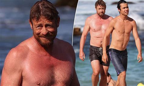 Simon Baker 52 Shows Off His Abs As He Relaxes With Son Claude Blue Baker At Bronte Beach