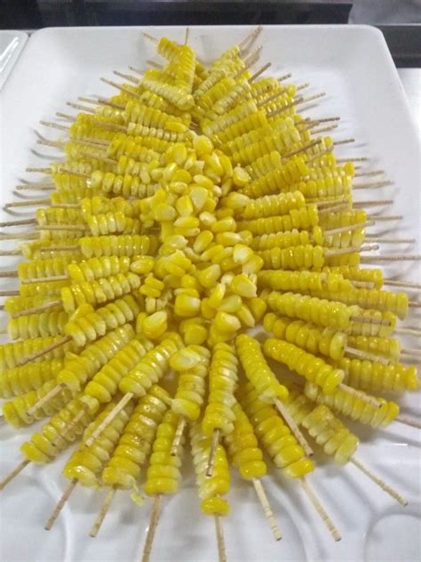 The Corn On The Cob Is Being Prepared To Be Grilled