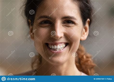 Closeup Portrait Of Young Hispanic Woman Smiling Looking At Camera