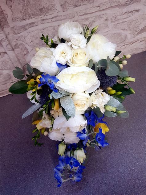 Cascading wedding bouquet in burgundy & dusty pink with eucalyptus greenery (cascade). Teardrop bouquet of white peonies, lizzianthus and roses ...