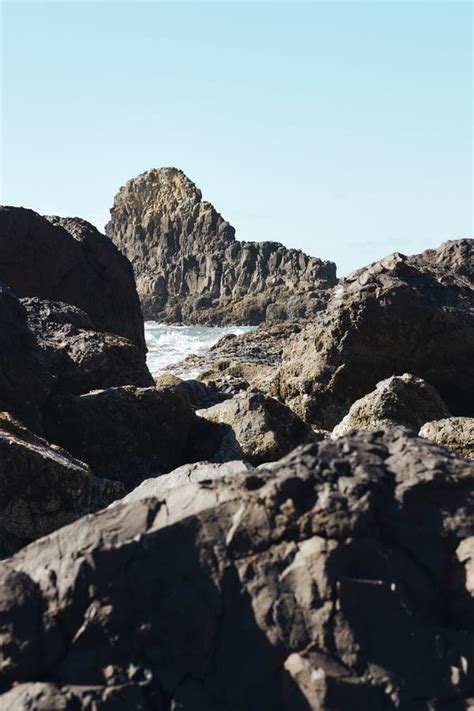 Vertical Shot Of Rocks At The Coastline Of The Pacific Northwest In