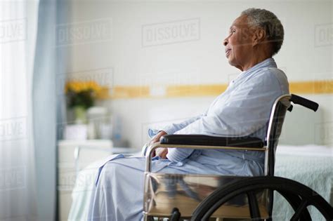 Black Woman Sitting In Wheelchair In Hospital Stock Photo Dissolve