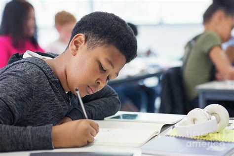 School Boy Student Doing Homework Photograph By Caia Imagescience