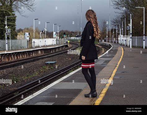 Girl Waiting For The Train At The Train Station Stock Photo Alamy