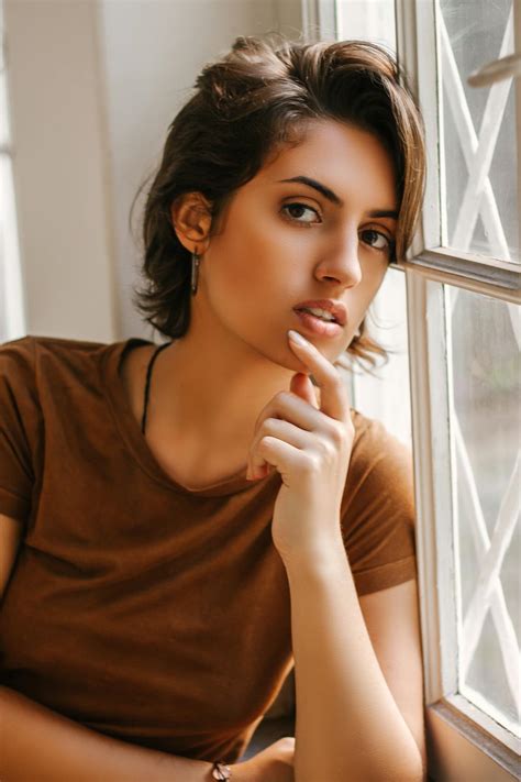 Close Up Photo Of Woman Leaning On Window · Free Stock Photo