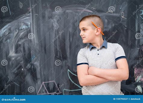 Portrait Of Little Boy In Front Of Chalkboard Stock Image Image Of