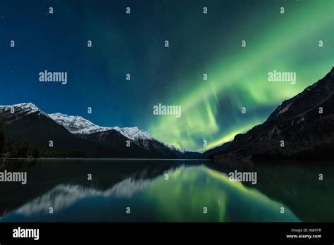 The Aurora Borealis Is Reflected In Chilkoot Lake Near Haines In