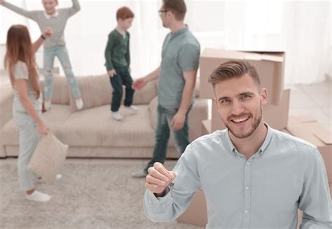 Premium Photo Smiling Estate Agent Showing Keys From New Apartments