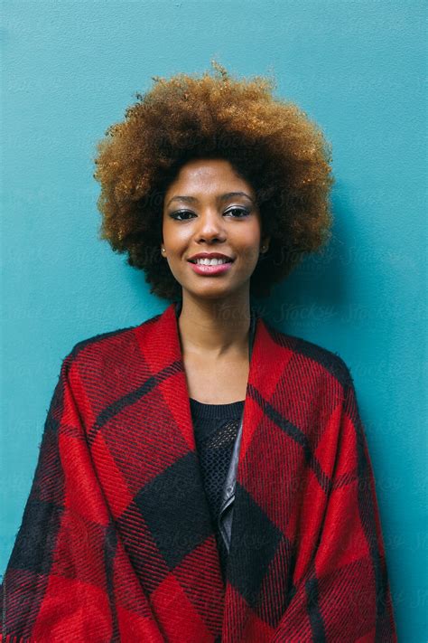 Beautiful Afro Woman Over A Blue Background Del Colaborador De Stocksy Victor Torres Stocksy