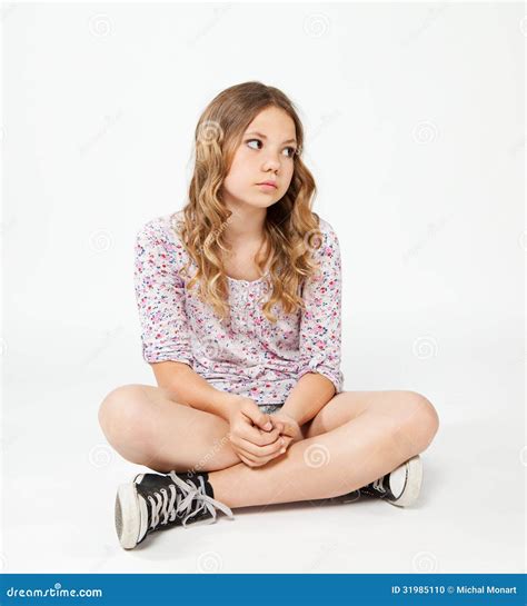 Teenage Girl Sitting On The Floor With Sad Face Royalty Free Stock