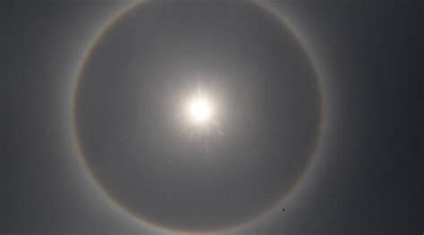 A sun halo is caused by the refraction, reflection, and dispersion of light. Kolkata witnesses rare red-blue '22 degree circular halo ...