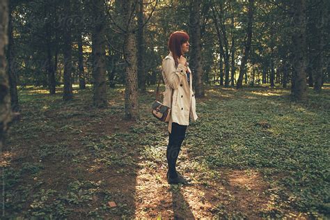 Woman Standing Alone In The Park By Stocksy Contributor Jovo Jovanovic Stocksy
