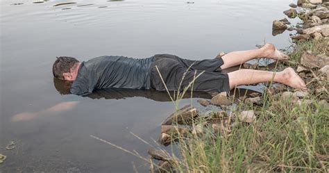 The Body Of A Man Who Drowned Lies Face Down In The Water The Lifeless