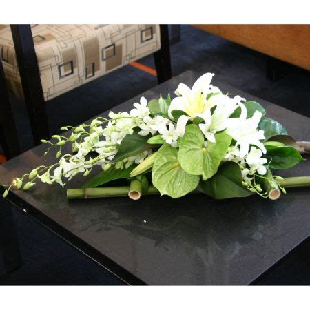 Your coffee table is a style centerpiece for your living ensemble, and whether you're gathering a room's style or gathering all of your friends, a piece like this is perfect for lending your ensemble a modern accent. iFlowers | Flowers | Corporate | Table flower arrangements ...