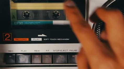 Insert Audio Cassette Into The Tape Player And Pushing Play And Stop