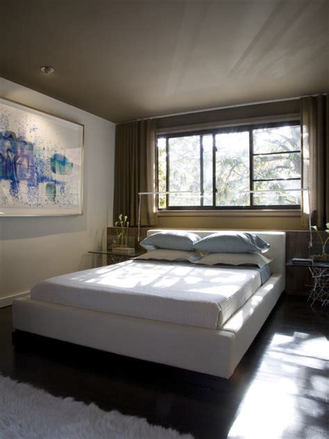 This one is set within a fitted unit, placed conveniently under a window and surrounded by mirrored fittings to add glamor and to increase the light cast into the niche. Bed Under Window Ideas, Pictures, Remodel and Decor