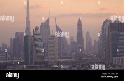 Zooming Out From View Of Downtown Skyline And Burj Khalifa At Sunset