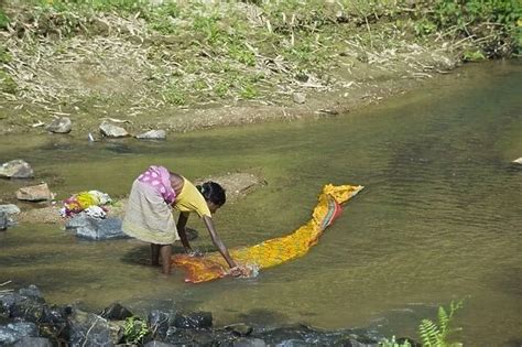 Woman Washing Clothes In River Date Available As Photo Prints Wall Art And Other Products