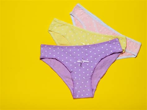 Premium Photo Colorful Womens Panties Stacked On A Yellow