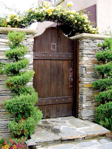 Here are our 10 latest entrance gate designs + their types & buying tips. Awesome Wooden Gate Design Ideas with Stone Rock Wall and ...