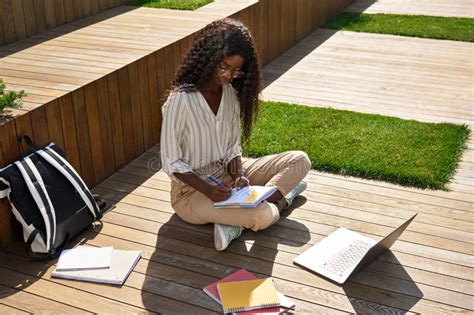 Black Young Woman Student Learning Using Laptop Studying Outside Campus