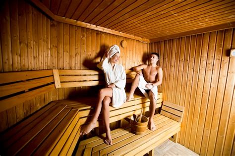 Premium Photo Young Couple Relaxing In Sauna